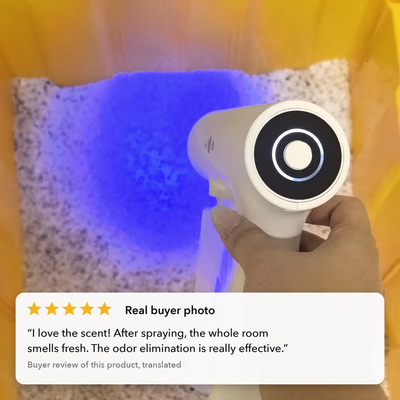 Real buyer photo: blue light mist over a litter tray